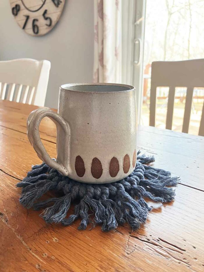 Macrame-Coasters-Product-Image---Blue---Under-Cup-on-Table